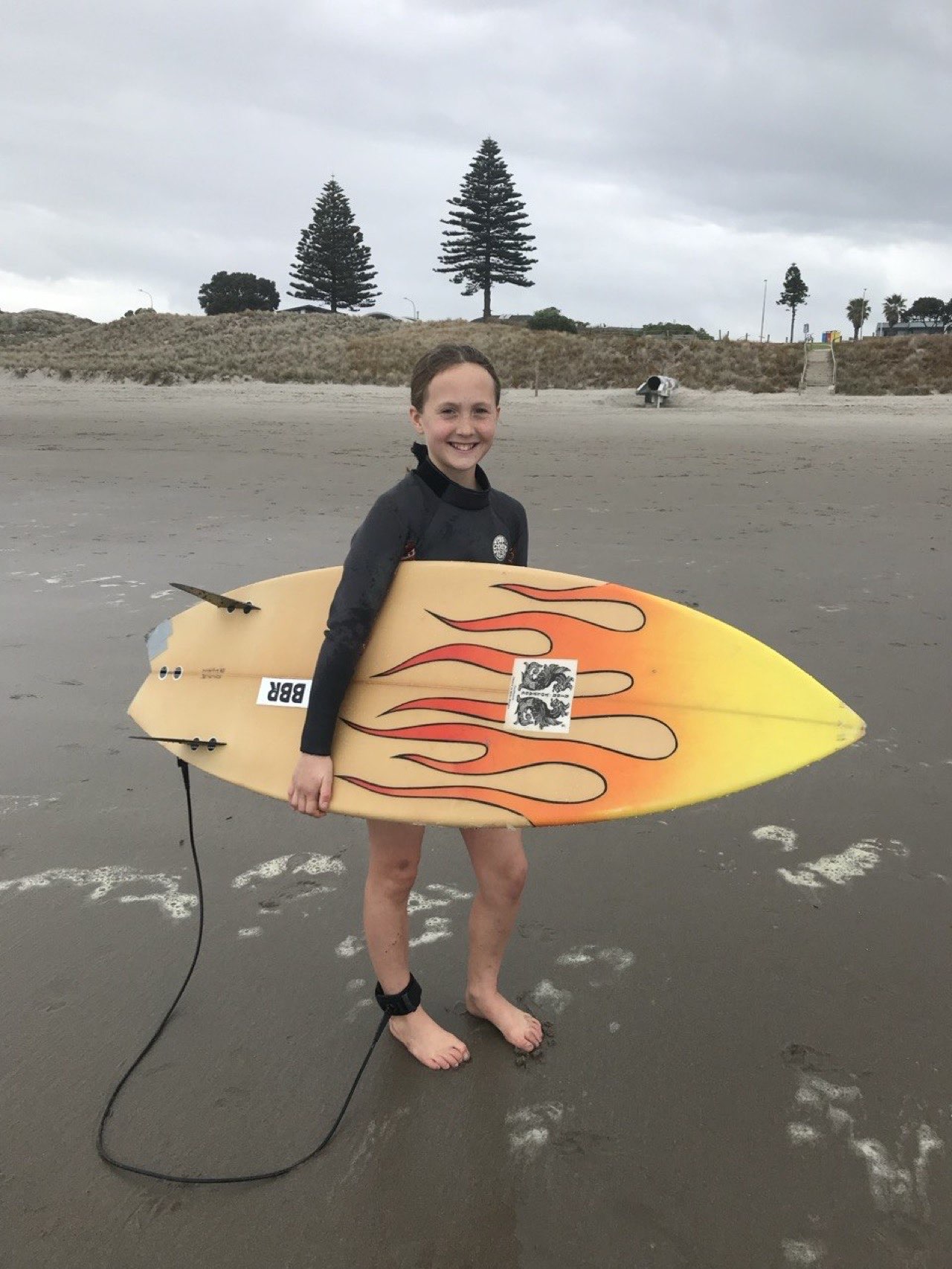 Surfboard with damaged rail before repair